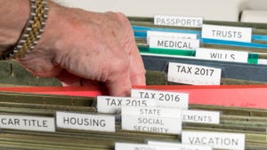 Man reaching out for taxes