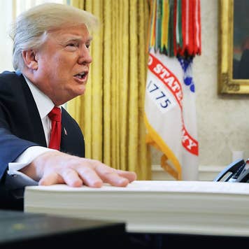 President Trump with tax reform documents