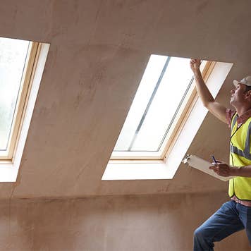 Man inspecting windows in a home inspection