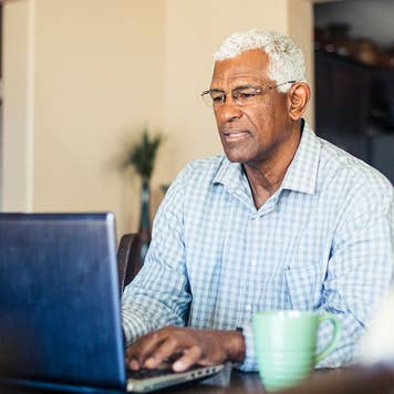 Man using laptop at home