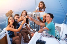 Friends toast on a yacht