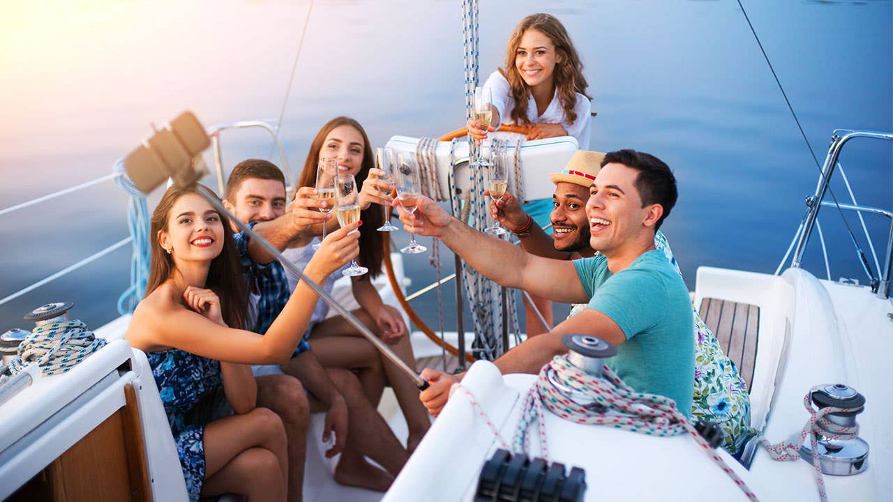 Friends toast on a yacht