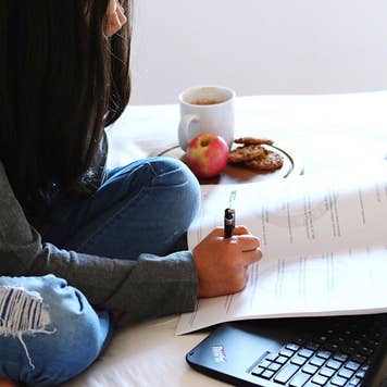 Student doing homework in dorm room