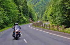 Couple motorcycling on the road
