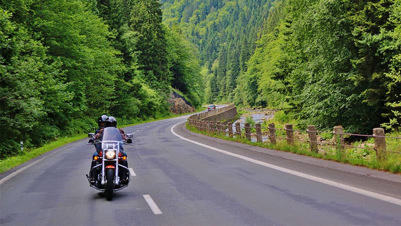 Couple motorcycling on the road