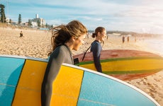 Two young women going surfing