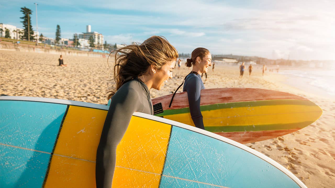 Two young women going surfing
