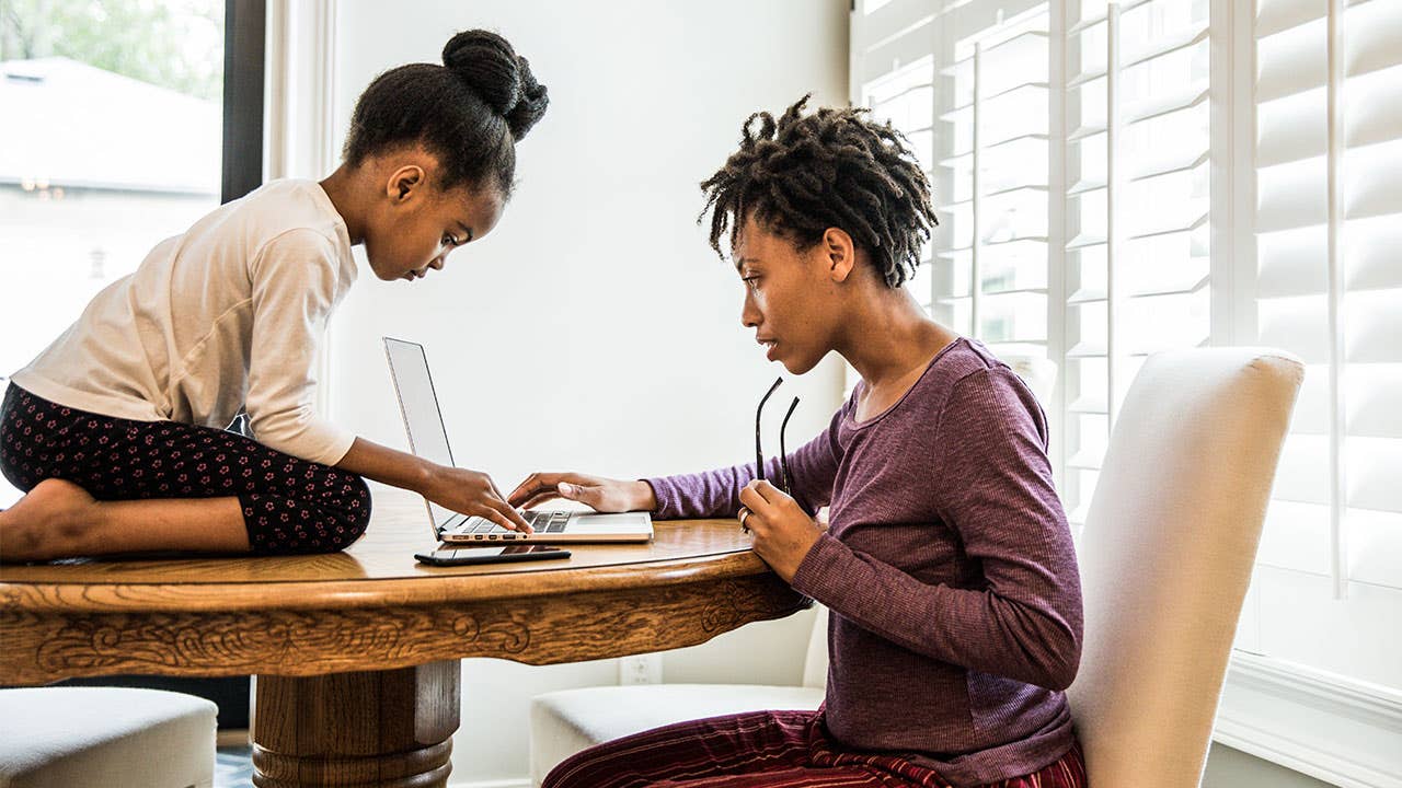 Mother and child working on computer