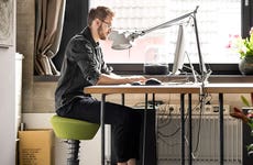 Man typing at desk