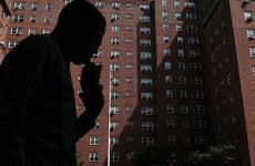 Man walking by public housing