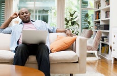 Man on laptop at home