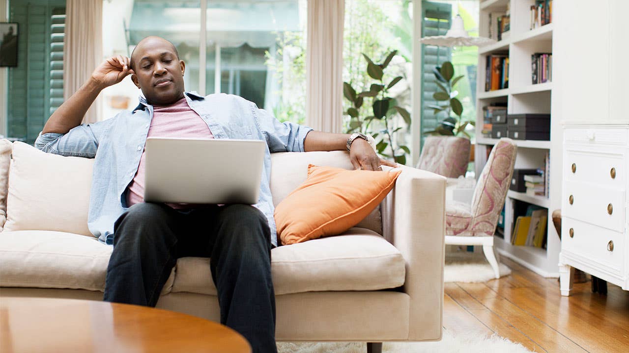 Man on laptop at home