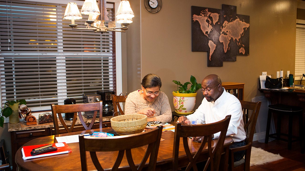 Couple discussing at the kitchen table