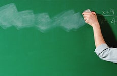 Woman erasing blackboard