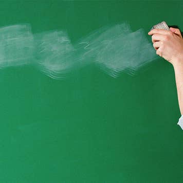 Woman erasing blackboard