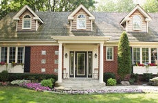 Brick home with landscaped front yard