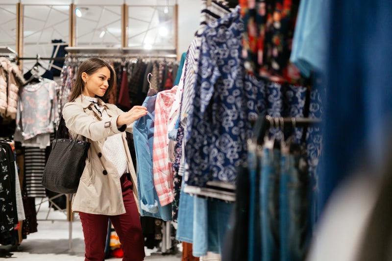 Young woman shopping for clothes