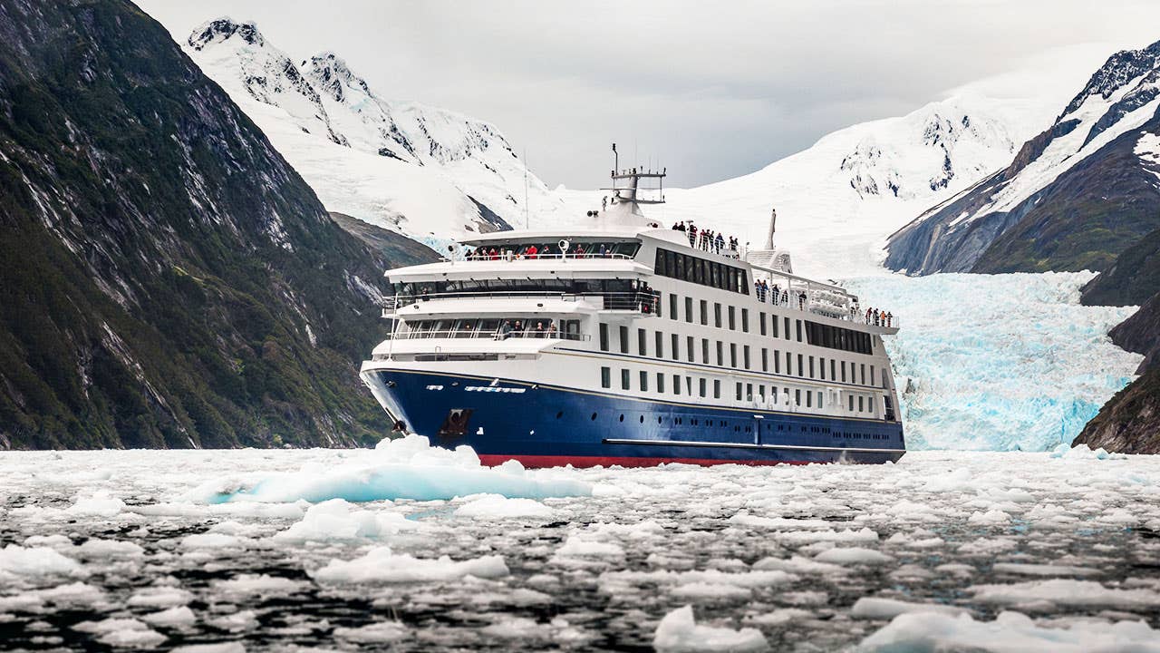 Cruise ship moving through icebergs