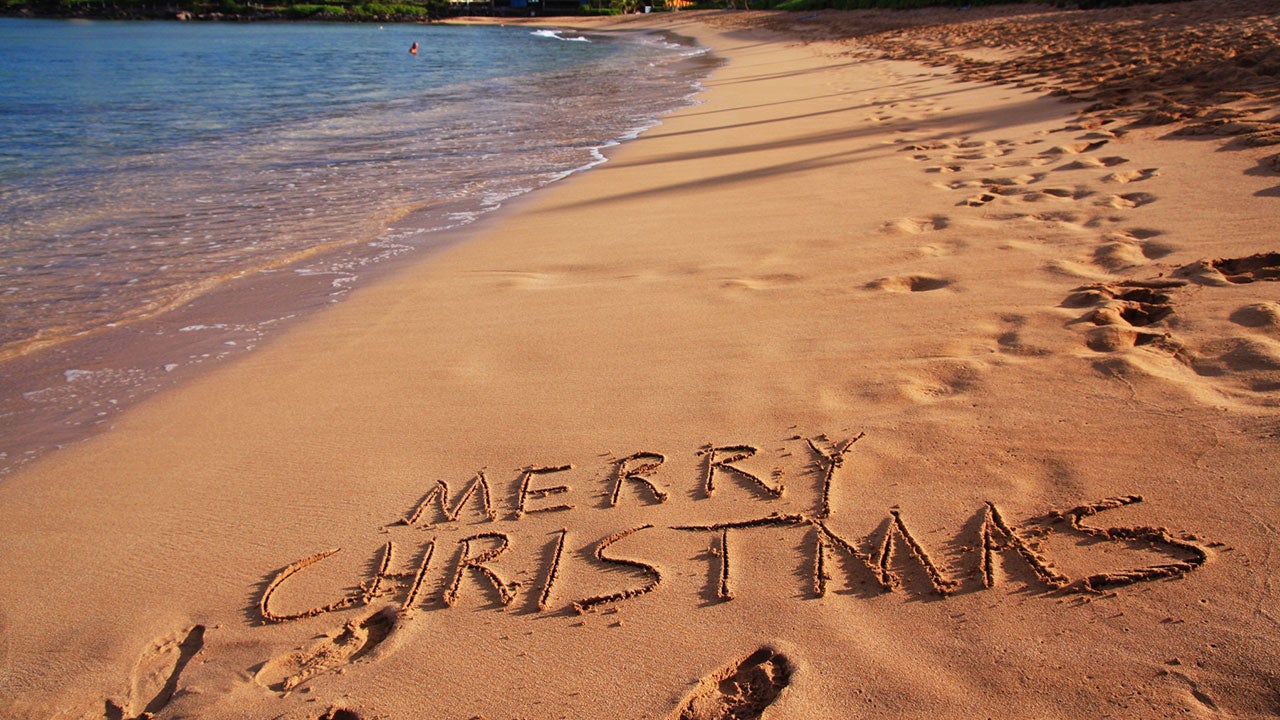 Merry Christmas written in sand