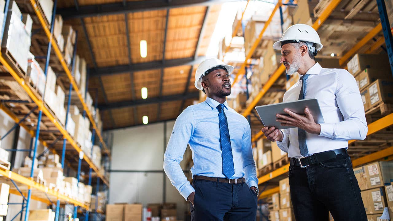 Supply managers in a warehouse