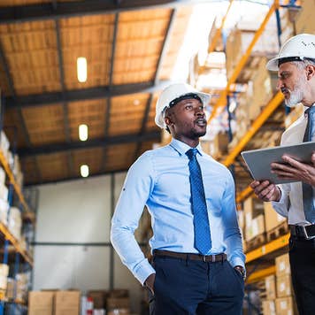 Supply managers in a warehouse