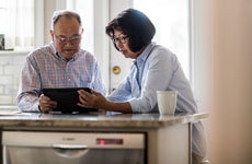 Couple banking on tablet