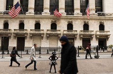 Pedestrians walking past the New York Stock Exchange