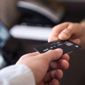 Person holding credit card