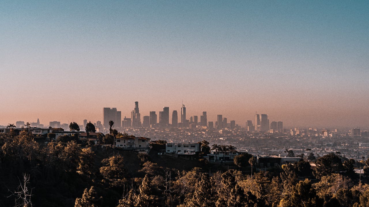 Aerial View Of Buildings in Los Angeles Against Sky During Sunset