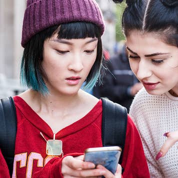 Friends looking at phone