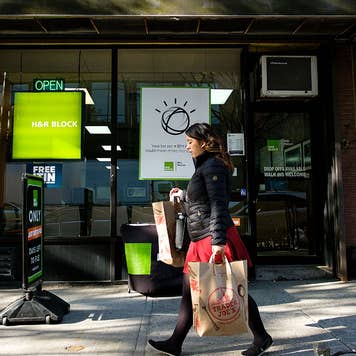 Woman walking past H&R Block