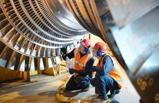 Manufacturing workers looking at a turbine