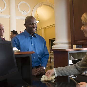 Bank teller with customer