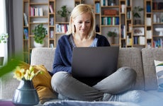Woman using laptop to set up an IRA online