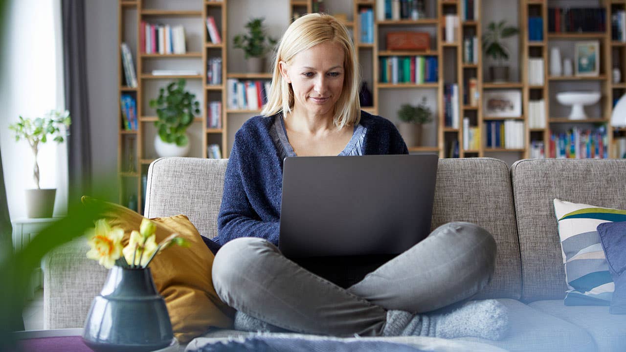 Woman using laptop to set up an IRA online