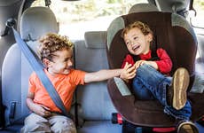 Kids playing in back seat of car