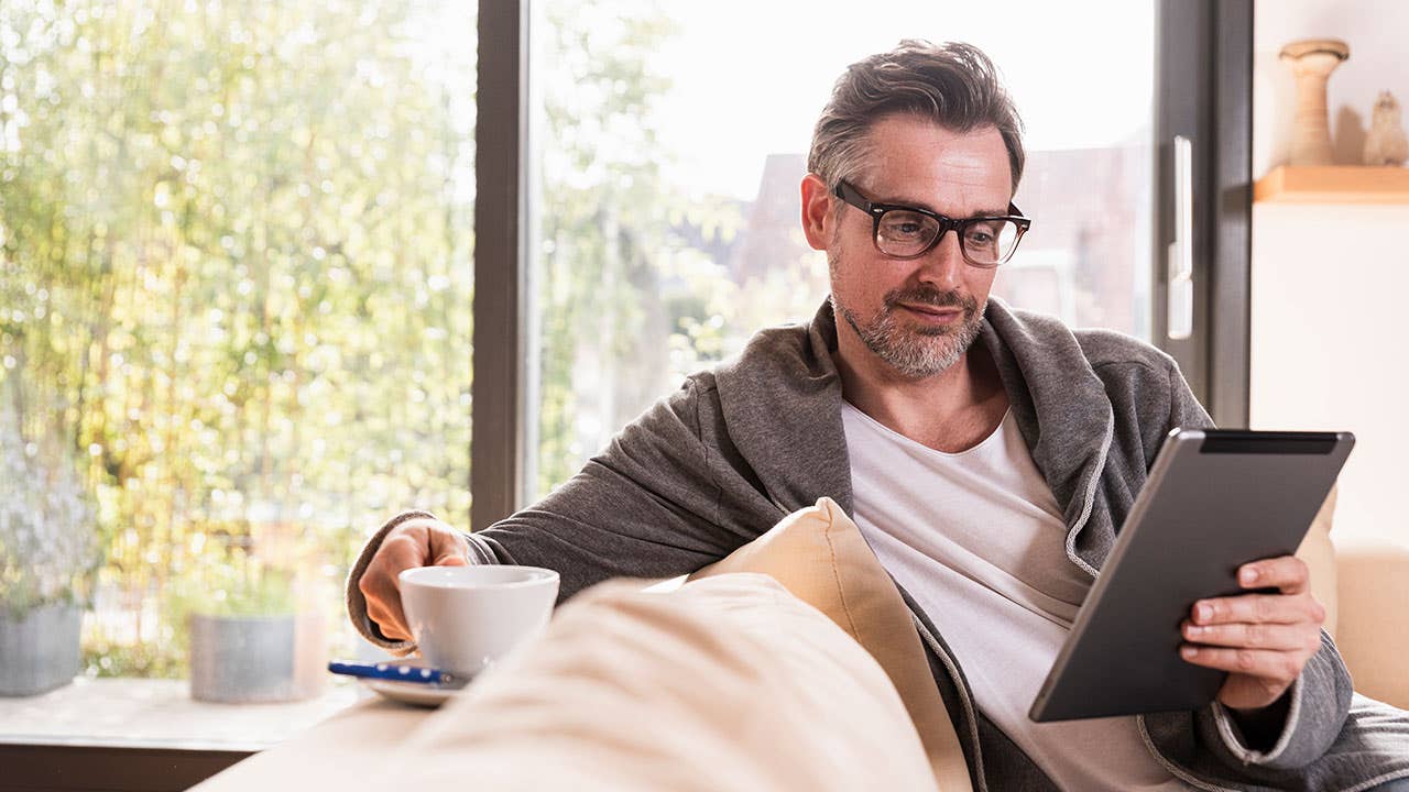 Man using a tablet for banking