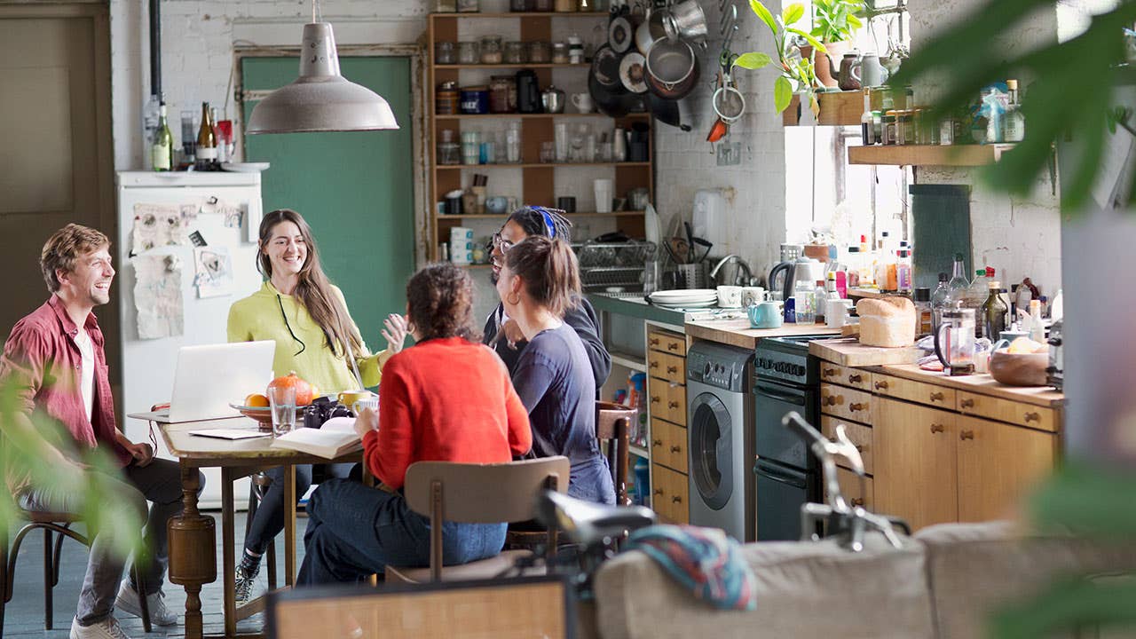Young millennials talking in kitchen