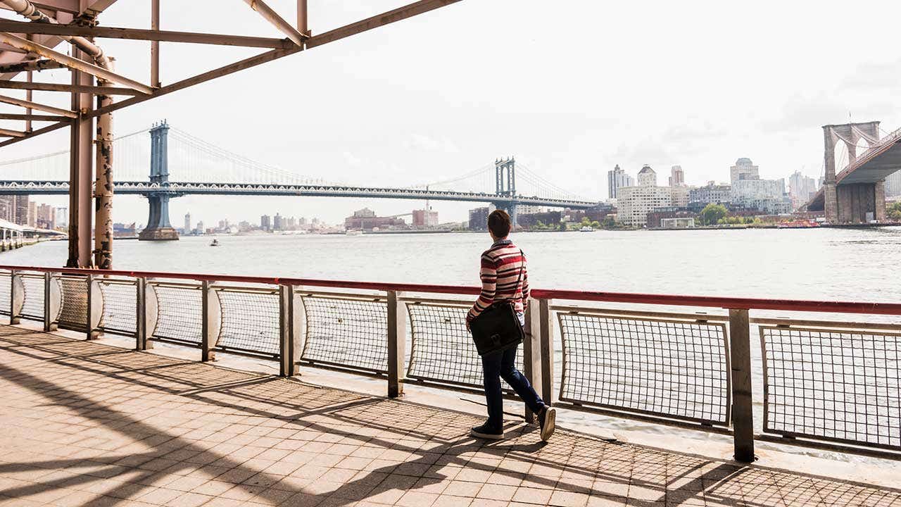 Woman walking in East River, New York City