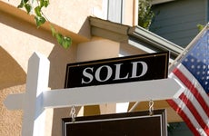 Sold sign in front of a house