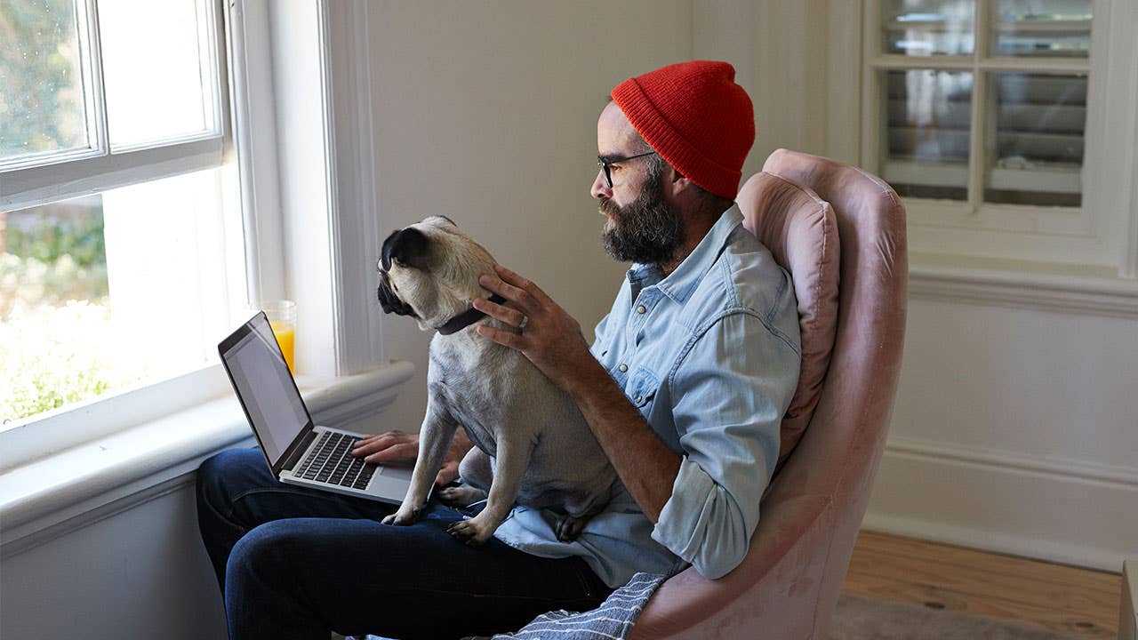 Man with pug home office