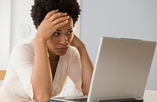 distressed woman with laptop