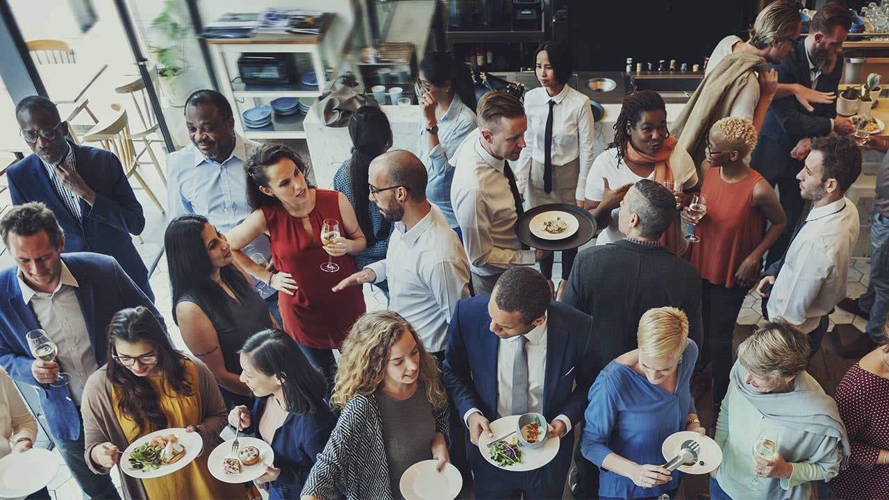Crowd of people at an event eating