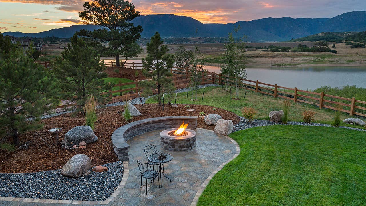 Firepit in a backyard along a river