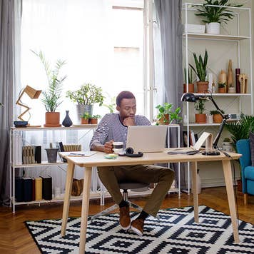 Man in home office online banking