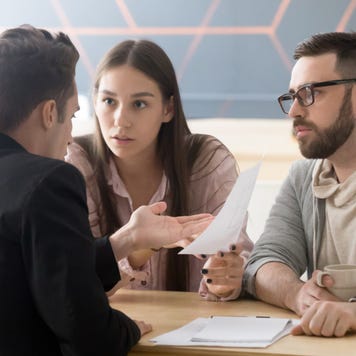 Couple discussing finances with lawyer