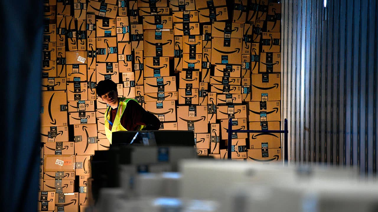 Amazon warehouse worker moving boxes