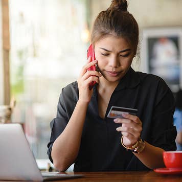 Woman on phone with credit card company