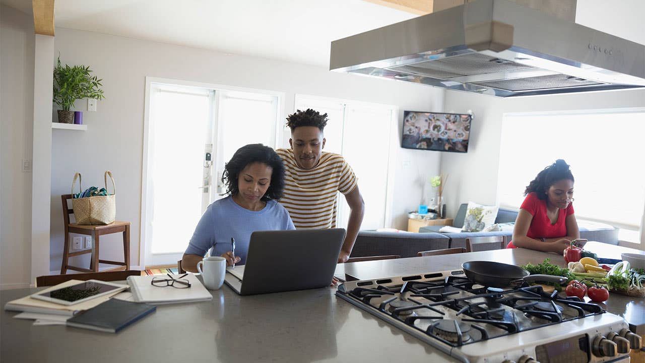 Couple working on finances in kitchen