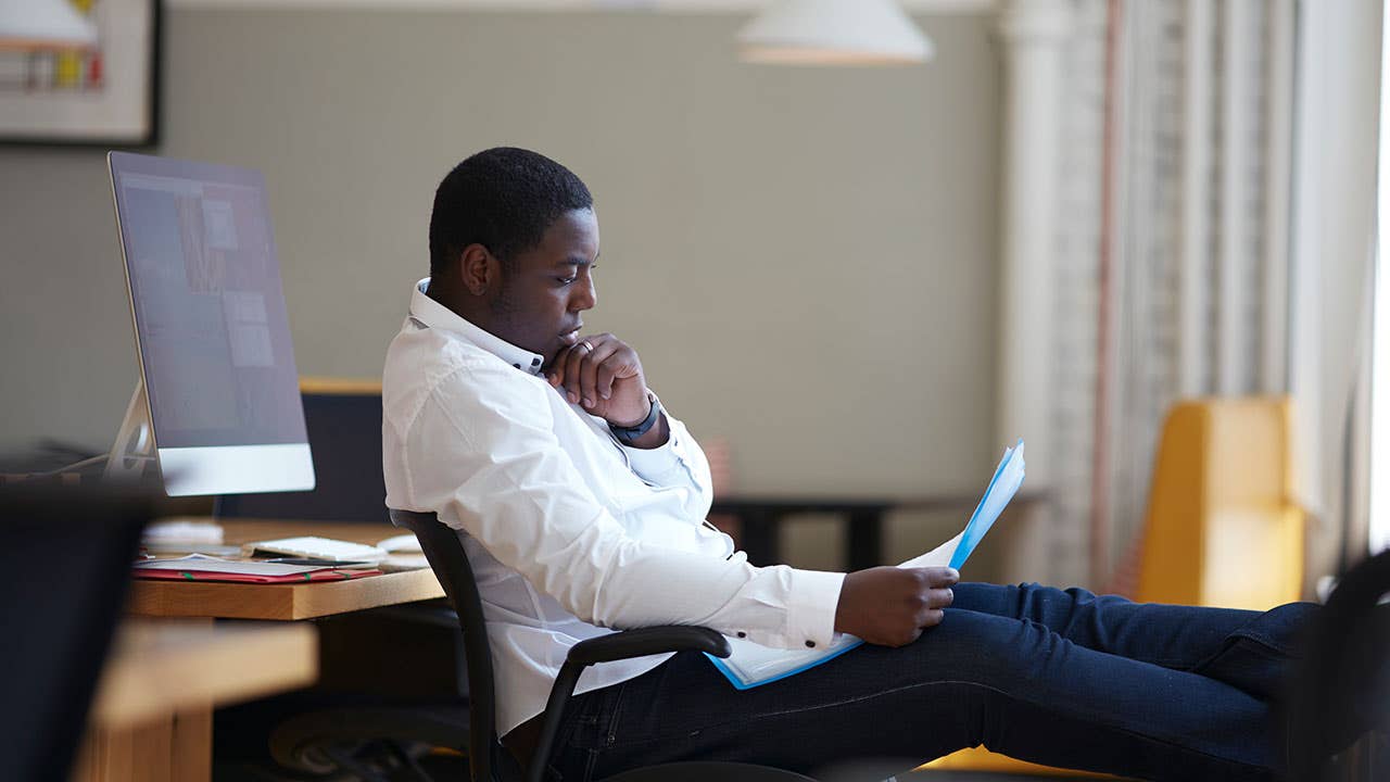 Man reviewing escrow paperwork